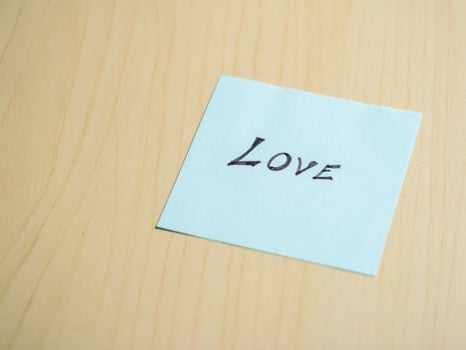 Sticky note love in a minimalist home office creative content emotional expression photo
