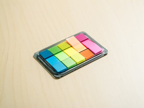 Creative workspace colorful sticky notes on wooden desk for minimalist productivity photo
