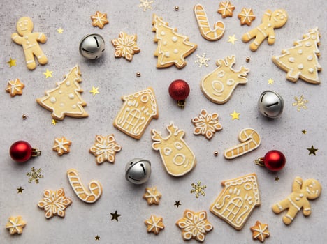 Christmas cookies forming a festive background with ornaments photo