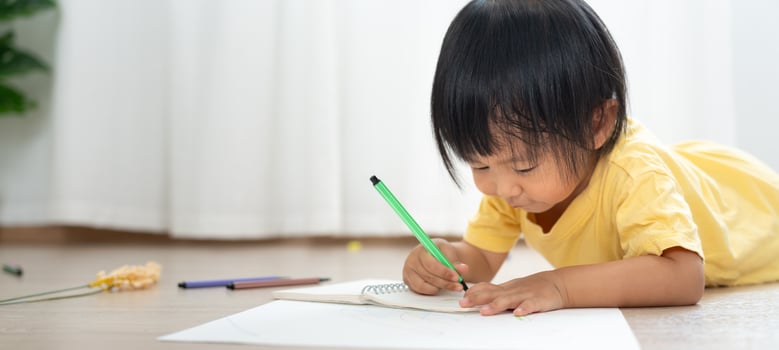 Happy Asia children playing learning paint on paper. Activity, development, IQ, EQ, meditation, brain, muscles, essential skills, family having fun spending time together. Holiday photo