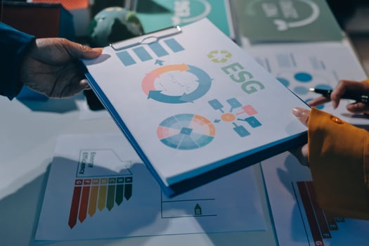 Business people holding folders with graphs and diagrams photo