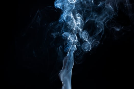 Smoke from flames or fog clouds graphic design art isolated on dark black background. photo