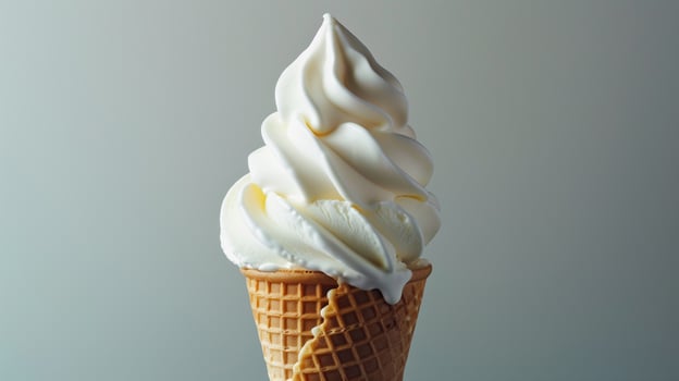 Swirl of soft-serve ice cream in a waffle cone, standing upright, food setting photo