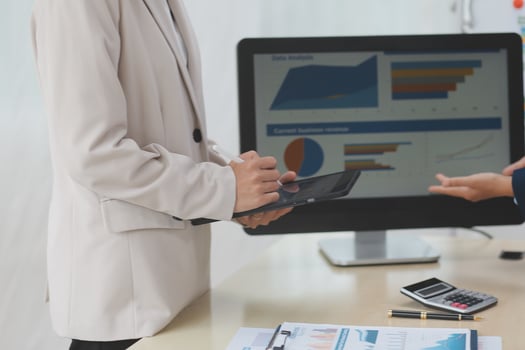 Two business people are talking on a computer photo
