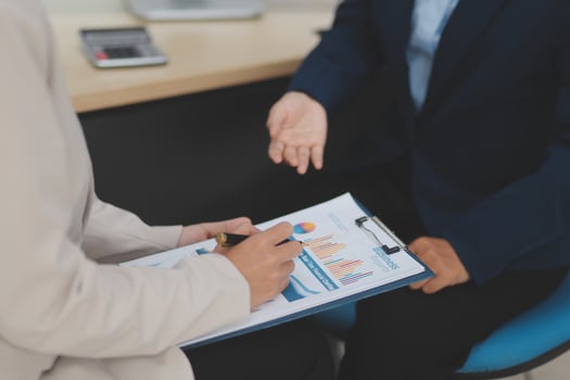 A business person is talking to another person photo