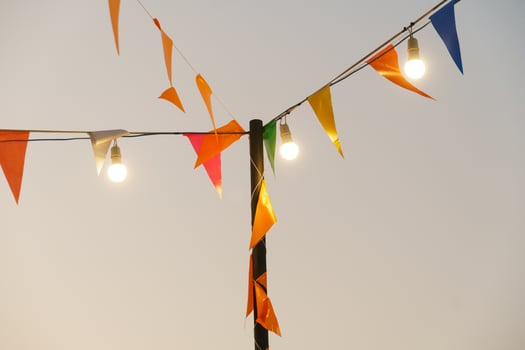 Colorful flags and lights create festive atmosphere in sky photo