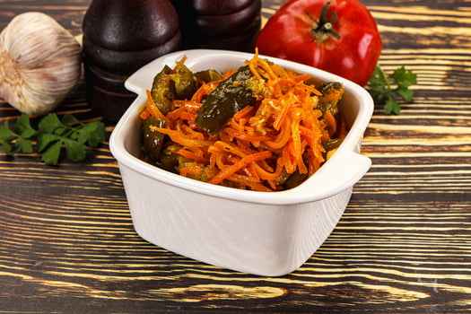 Salad with korean carrot and cucumber photo