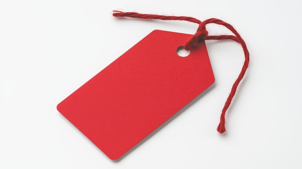 Bright Red Cardboard Tag with String for Retail and Holiday Gifts on White Background photo