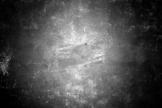 Abstract black and white grunge texture with a distressed, scratched surface, ideal for backgrounds and overlays. photo