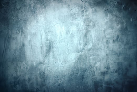 Blue-toned textured concrete wall featuring brush stroke patterns and faint cracks, ideal for backgrounds or overlays. photo