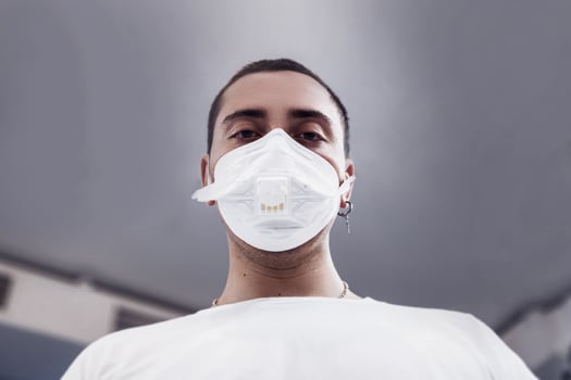 A man puts on a mask from a virus. Flu epidemic. photo