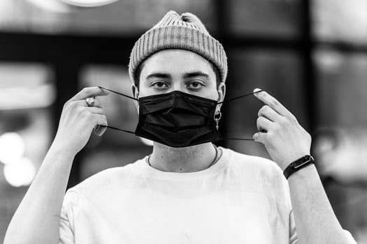 A man puts on a mask from a virus. Flu epidemic. photo