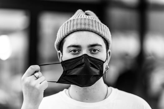A man puts on a mask from a virus. Flu epidemic. photo