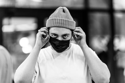 A man puts on a mask from a virus. Flu epidemic. photo