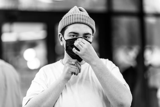 A man puts on a mask from a virus. Flu epidemic. photo