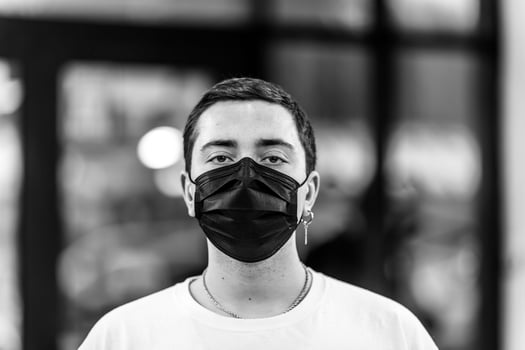 A man puts on a mask from a virus. Flu epidemic. photo