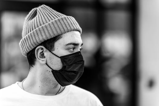A man puts on a mask from a virus. photo