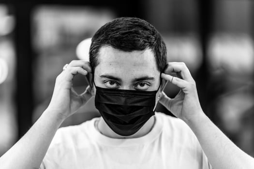 A man puts on a mask from a virus. photo