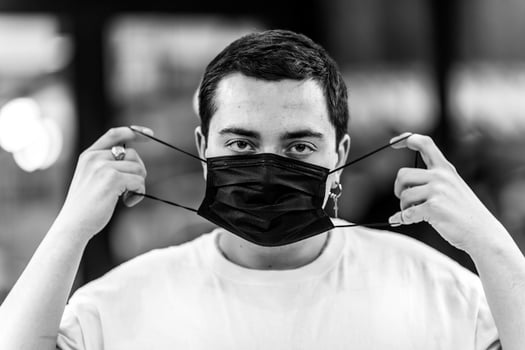 A man puts on a mask from a virus. photo
