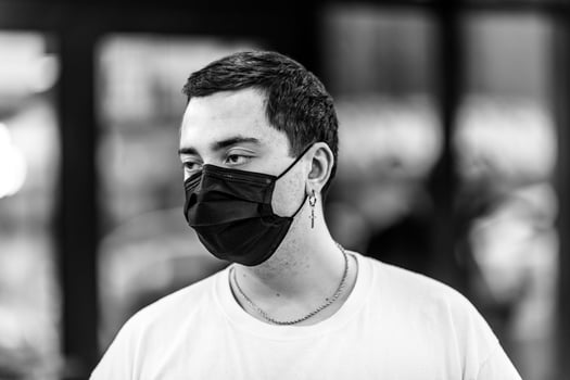 A man puts on a mask from a virus. photo