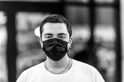 A man puts on a mask from a virus. photo