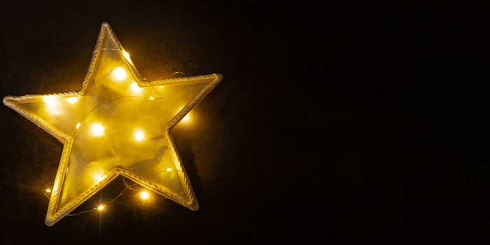 Christmas star made of ice cream sticks. Gift idea. Do it yourself instruction eco-friendly decoration. Zero waste Making handmade presents children's diy projects. Holiday family time. Creative activity photo