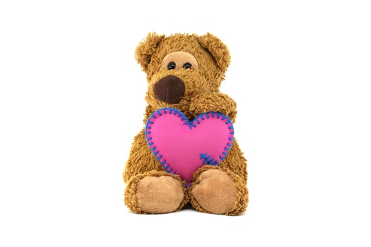 Adorable Teddy Bear Holding a Pink Heart Symbol of Love photo