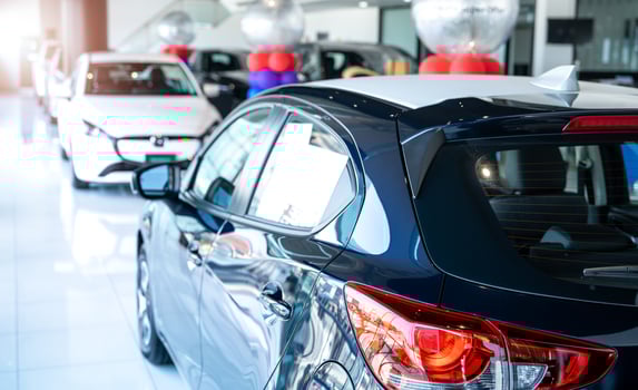 Car parked in luxury showroom. Car dealership office. Car showroom business. New car parked in modern showroom. Auto for sale and rent business. Automobile leasing and insurance. Electric automobile. photo