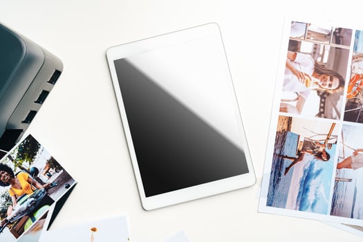 Printer and digital tablet on table. Printing photos concept