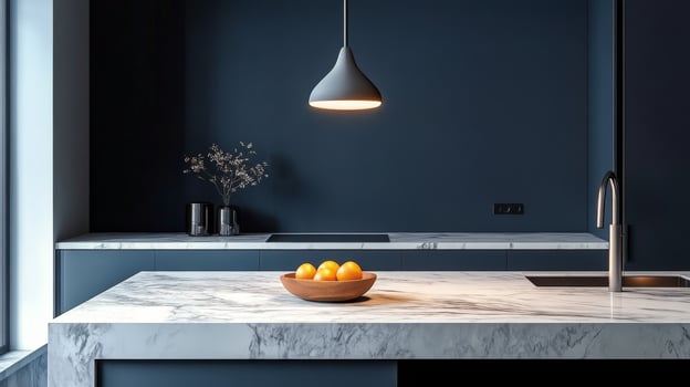Sleek modern kitchen with marble countertop and bowl of oranges photo
