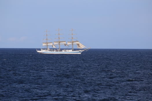 SASSNITZ, GERMANY - SEPTEMBER 15 2015 The sailing ship Mir of the Russian shipping company Rosmorport is sailing on the Baltic Sea near Sassnitz, Germany photo