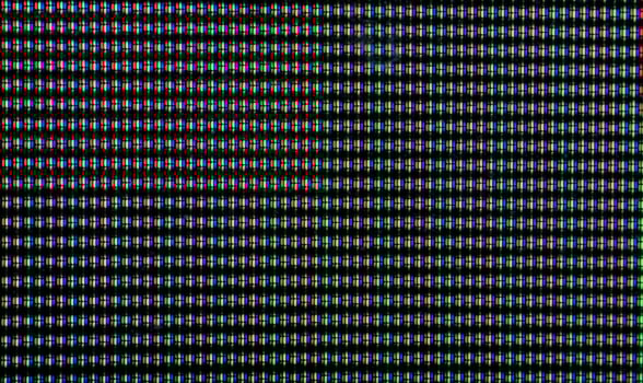 Macro shot of CRT screen with red, blue, and green dots photo