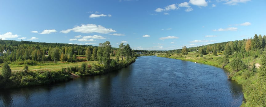 Panoramic shot of the idyllic river Vaesterdalaelven in Saelen photo