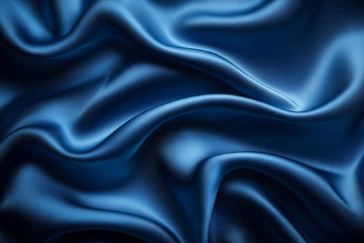 Rich blue silk fabric draped gracefully conveying elegance and luxury in soft textures. photo