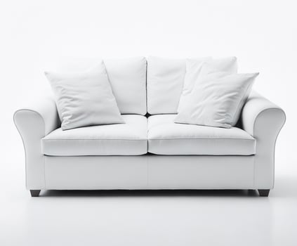 Modern white sofa with pillows on white background photo