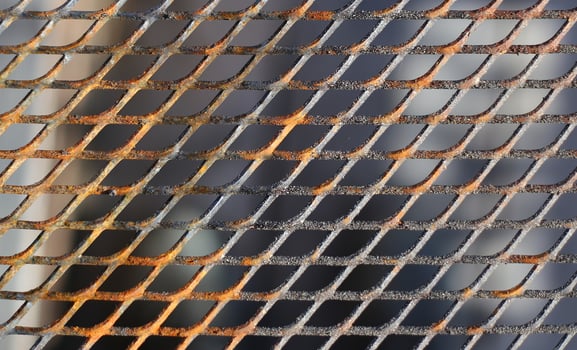 Close up of a slightly rusty cooking grate photo