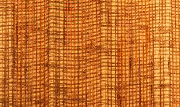 Close-up of a textile surface with orange and brown color photo