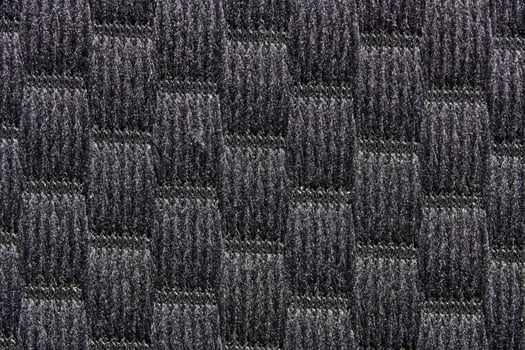 Close up of carbon fiber texture with checkered pattern in black and gray. photo