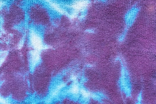 Vivid blue and purple abstract tie dye pattern with soft texture and blended colors. photo