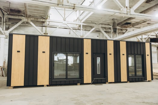 Modular building under construction inside a large industrial facility photo