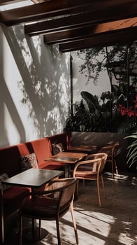 Cozy cafe corner with natural light and greenery in a tranquil atmosphere. photo