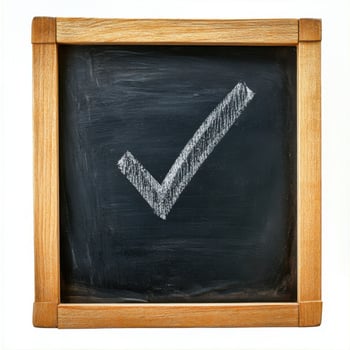 Check box with a tick drawn in chalk on a blackboard photo