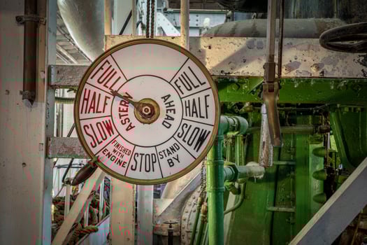 telegraph controls in engine room of a vintage steamship photo