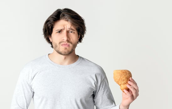 Food poisoning concept. Sad man holding his stomach, free space photo