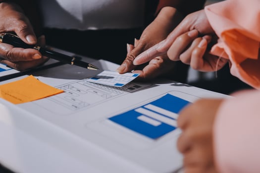 People are using a pen to sign a document photo