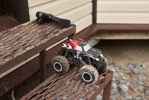 Using a Remote Control Monster Truck as it navigates the challenging Outdoor Steps outside photo
