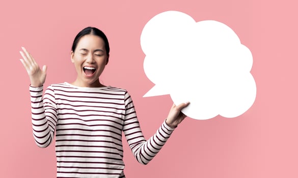 Crazy Idea. Emotional Asian Woman Holding Blank Speech Bubble And Screaming With Excitement, Surprised Young Korean Female Reacting To Nice Offer While Standing Over Pink Background, Copy Space photo