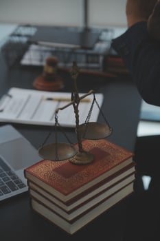 Lawyer working on laptop and books photo