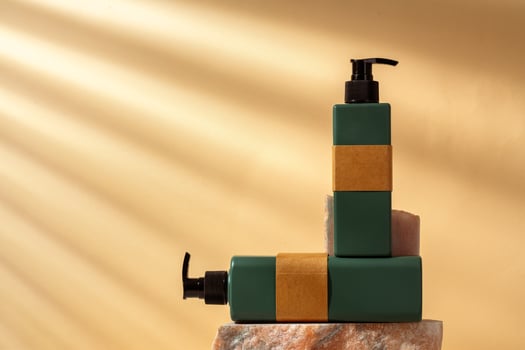 Cosmetic package dispenser with granite stone studio shot photo