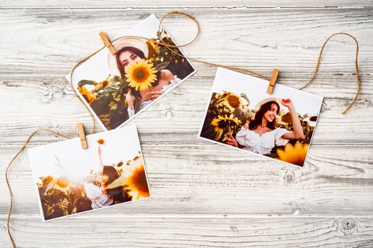 Printed colorful photos of women portraits against gray background